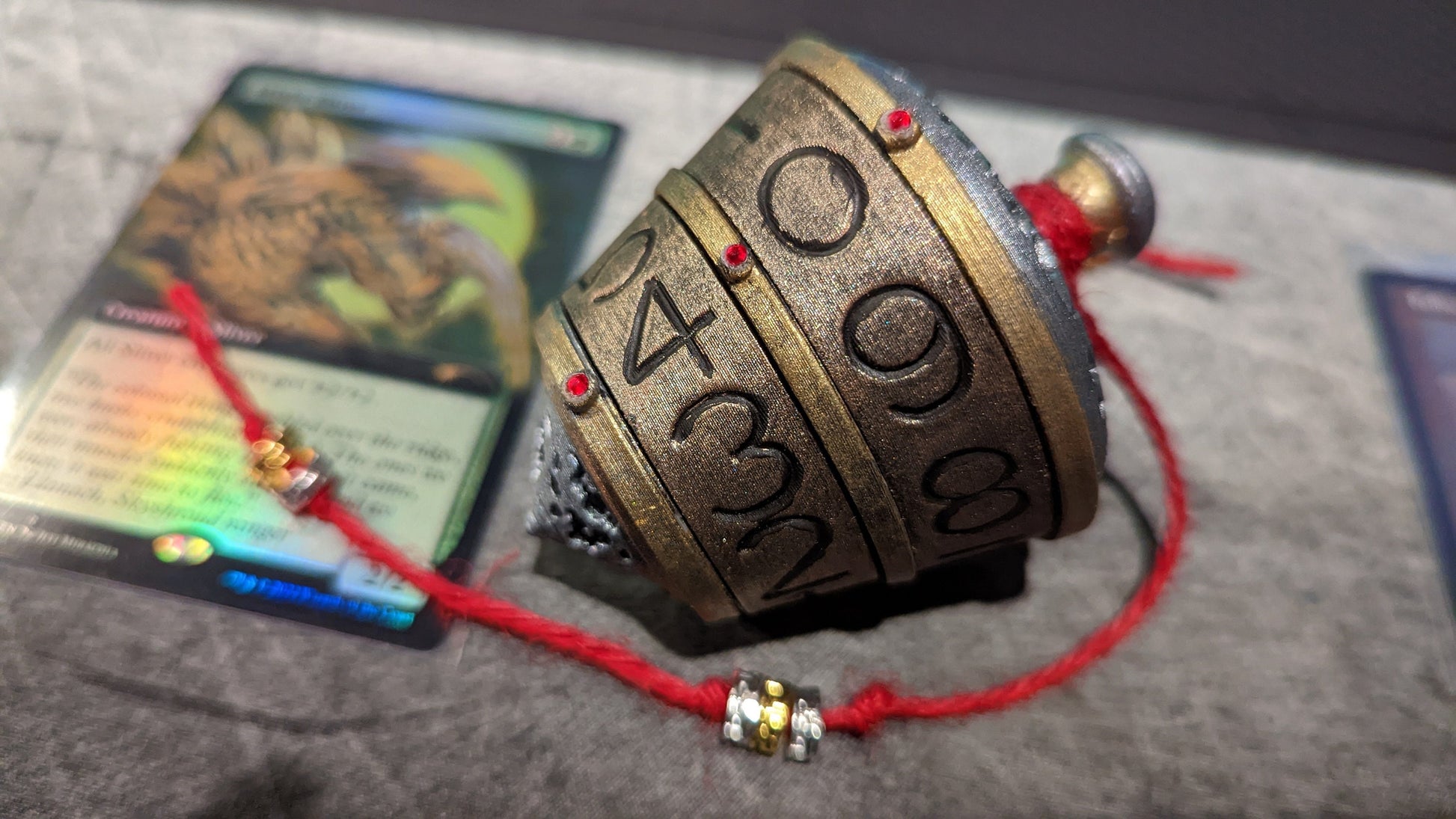 Classic finish with red cord and red gems